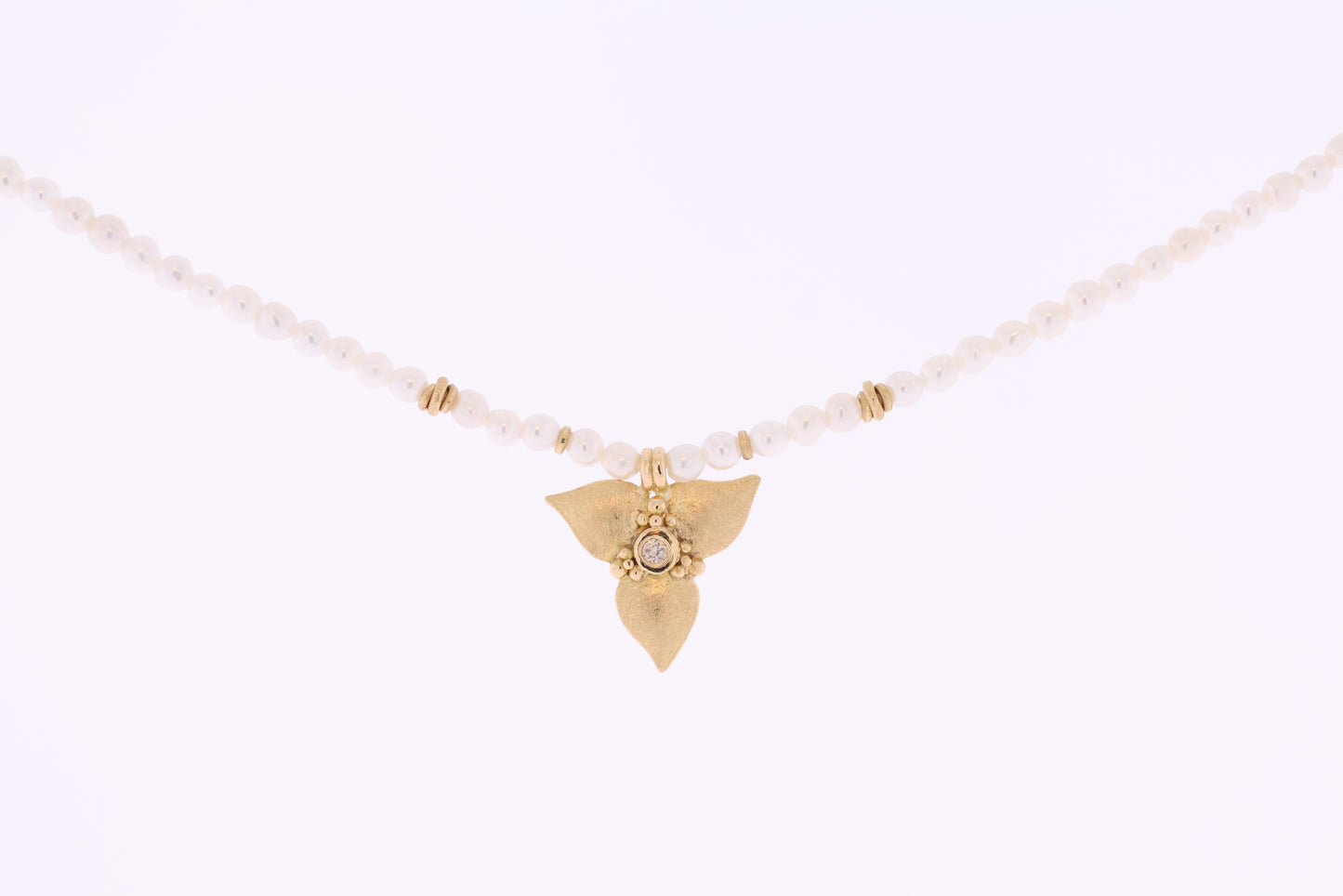 Pearl chain with golden bloom